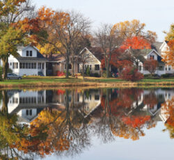 Fall,cityscape,with,private,houses,neighborhood,along,a,pond.,colorful