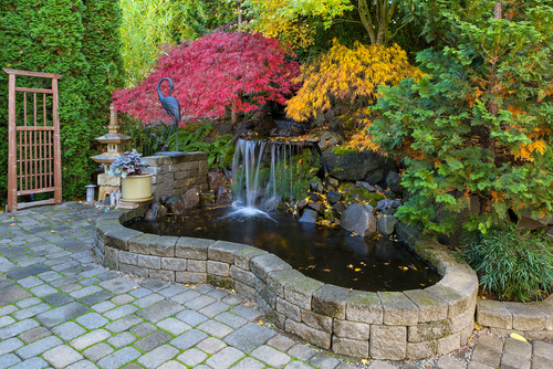 Home,garden,waterfall,pond,with,brick,paver,stone,hardscape,and