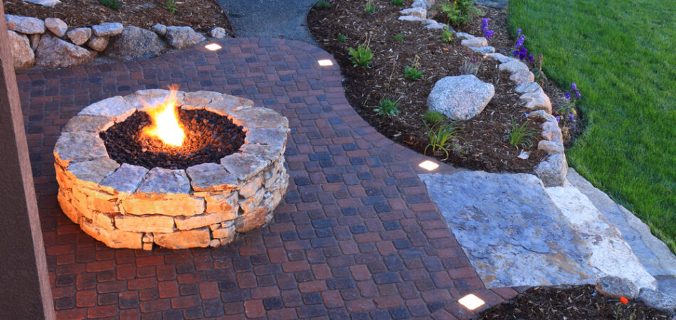 Awesome,backyard,with,fire,pit,and,illuminated,paver,patio